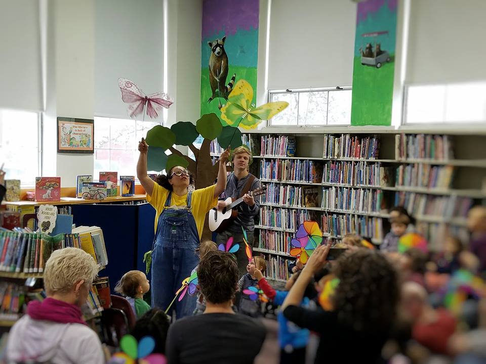 performers and audience at East Branch library