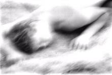 deliberately blurred black and white photo of a person sleeping